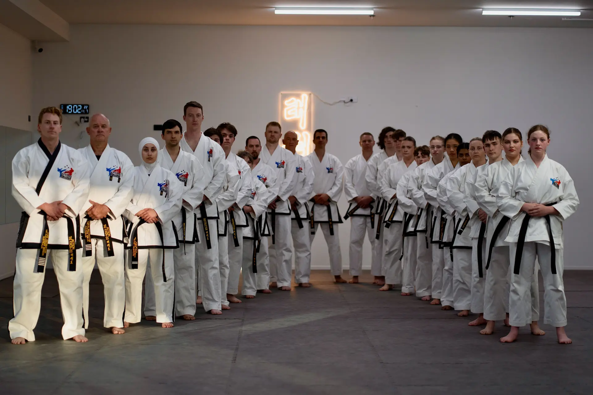 Action Tae Kwon-Do students in a formal line at training